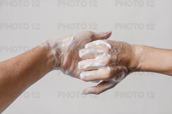 Hygiene concept washing hands with soap front view