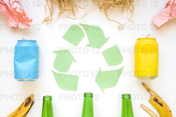 Paper recycle logo with colorful garbage