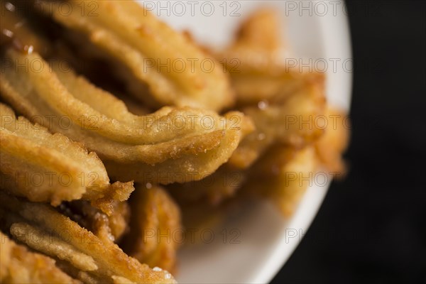 High view fried churros plate