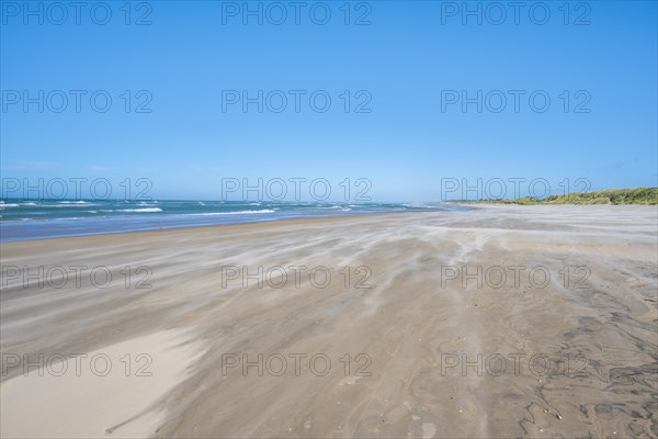 Wide sandy beach by the sea
