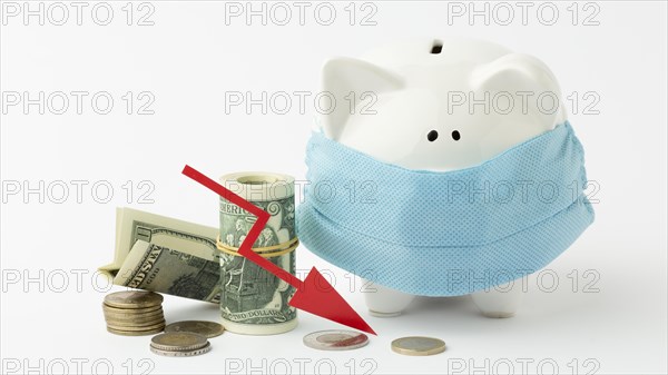 Piggy bank wearing medical mask bankruptcy concept