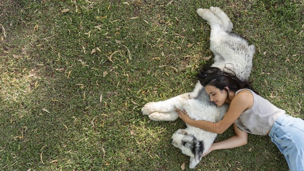 Woman dog sitting grass