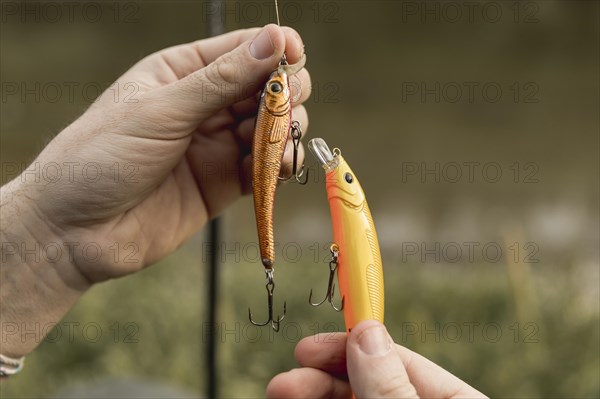 Person fixing fish hook