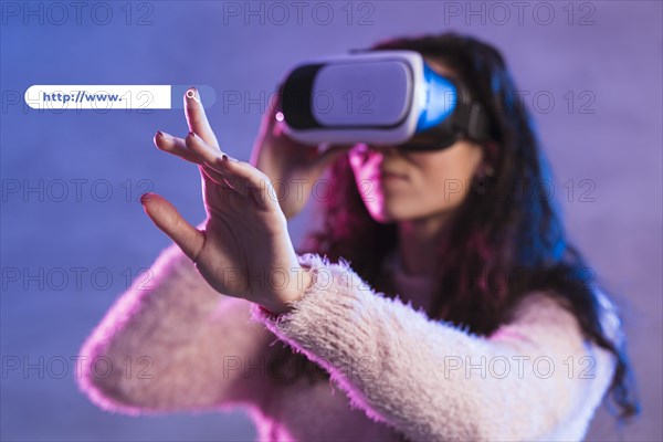 Front view woman using virtual reality headset