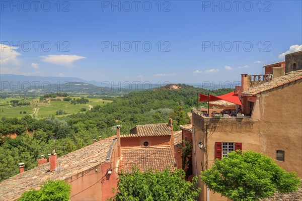 View over the houses of Roussillon into the landscape of the Luberon