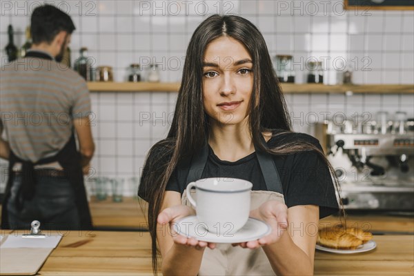 Bartender offering hot drink