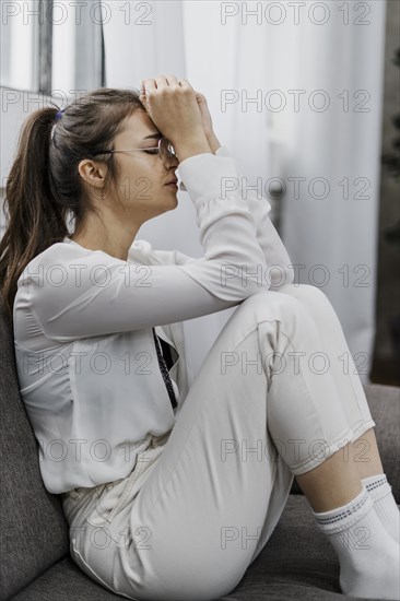 Side view woman looking sad as she works from home