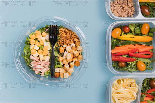 Top view work lunchboxes salad