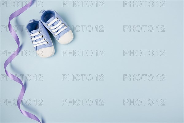 Blue ribbon shoes copy space