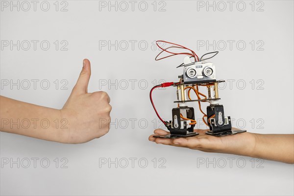 Hand with robot ok sign