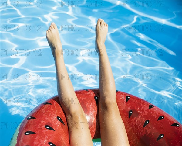 Upside down legs with watermelon floatie