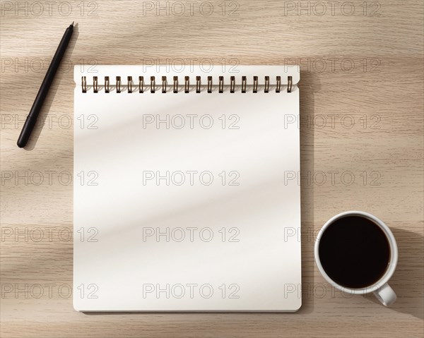 Top view notebook with mug pen