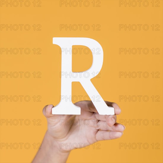 Deaf woman s hand holding r alphabet