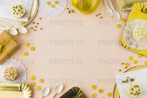 Elevated view muffins gifts colored background