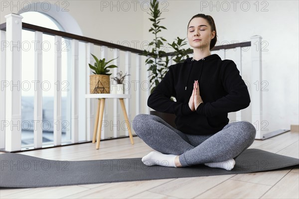 Female meditating indoor