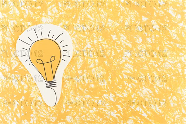 Hand drawn light bulb cut out yellow pattern background