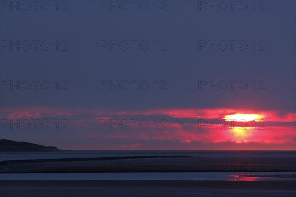 View from the island of Minsener Oog to Wangerooge at sunset