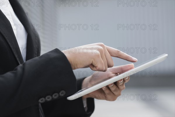 Close up hand pointing ipad