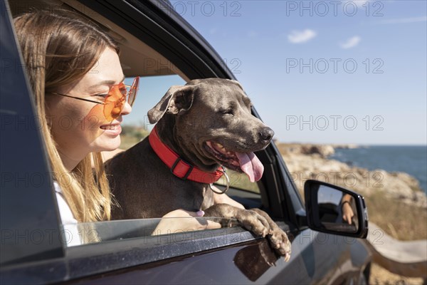 Side view young woman dog going trip