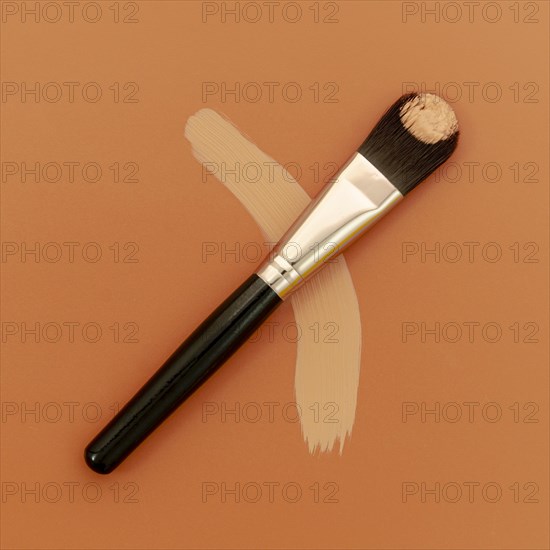 Foundation brush brown background