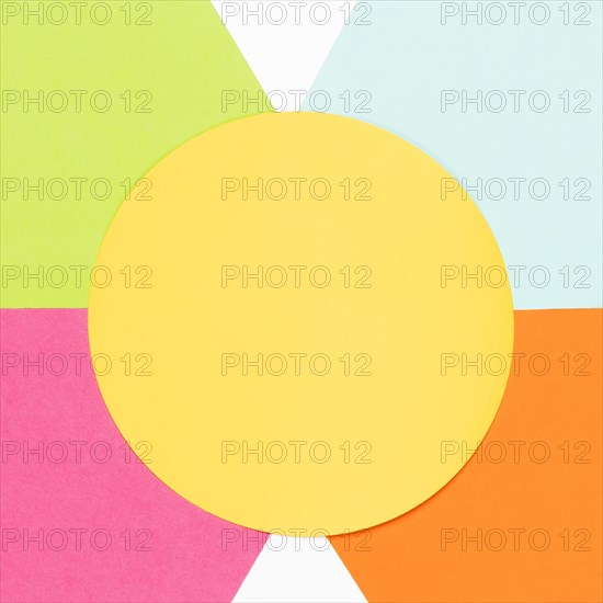 Top view yellow circle with colorful geometric shapes