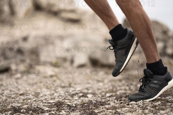 Close up man s feet trail nature