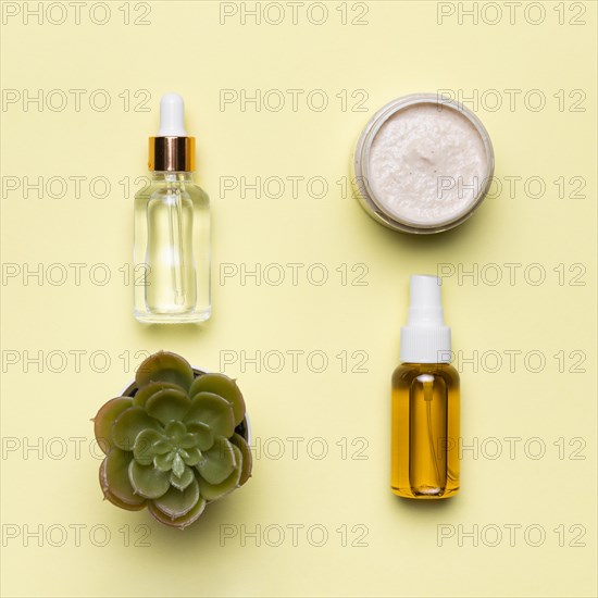 Flat lay serum bottles with creme