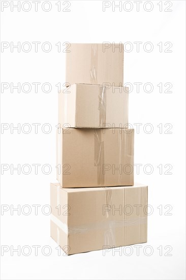 Stacked cardboard boxes isolated white background