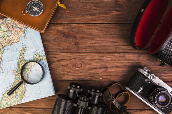 Old fashionable travel stuff wooden table