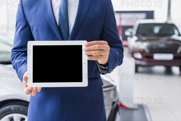 Car salesman with tablet