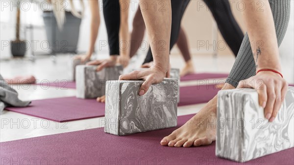 Close up hands holding bricks