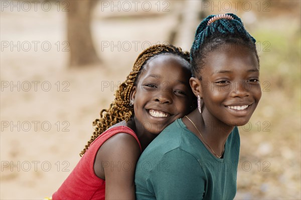 Close up smiley african girls outdoors