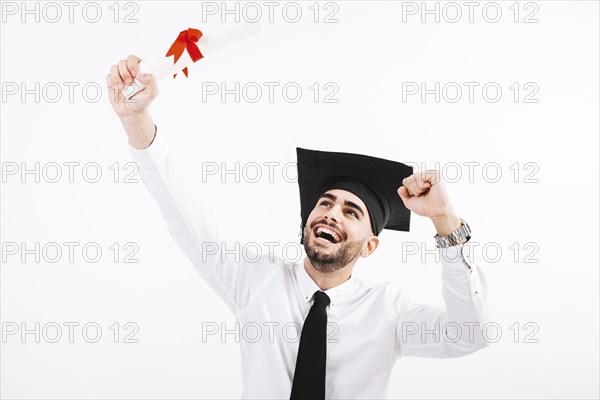Happy man with diploma academic cap