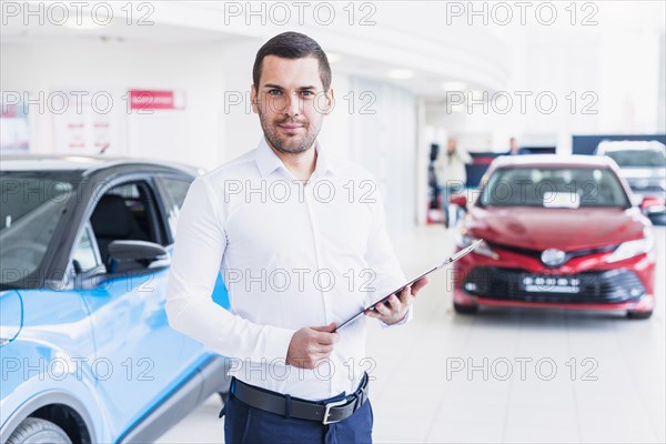 Portrait salesman car dealership