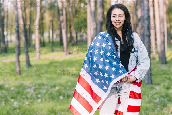 Young female covered with flag usa