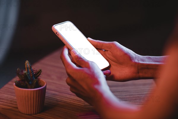 Side view man holding smartphone