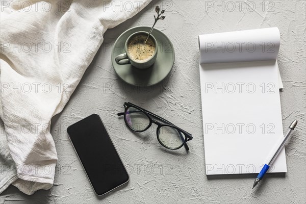 Workplace with smartphone blank notepad