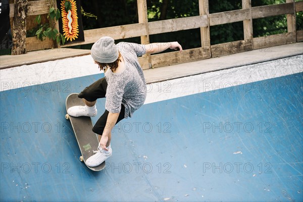 Man riding skateboard ramp