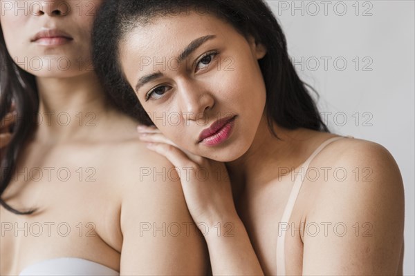 Sensual ethnic woman with female