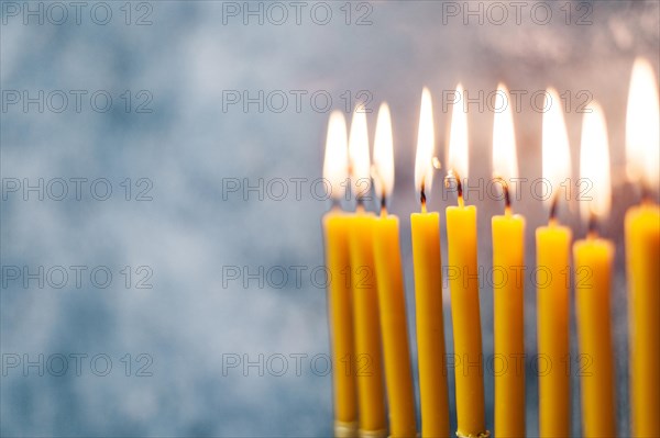 Close up holy candlesticks burning