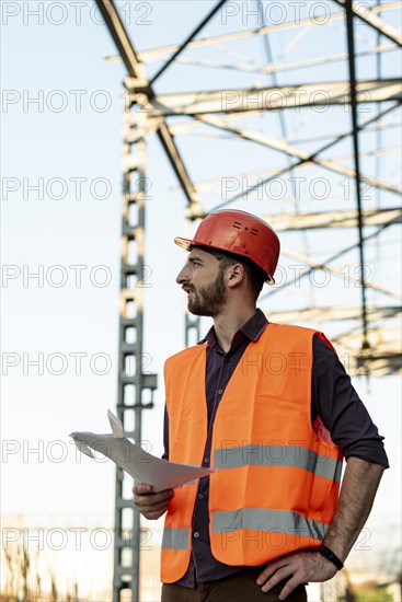 Medium shot man holding plan