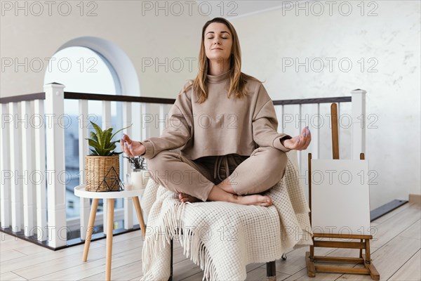 Woman meditating indoor