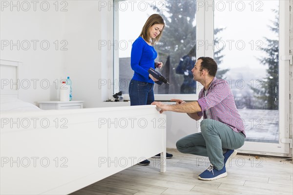 Couple assembling bed