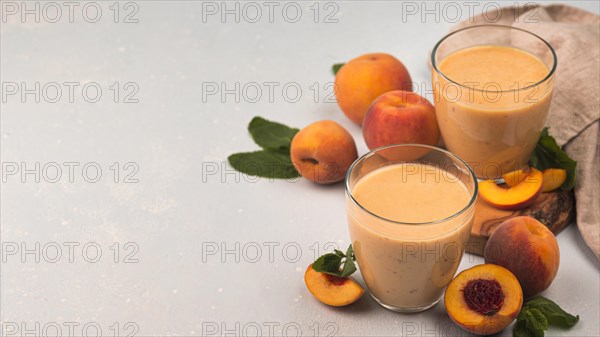 High angle milkshake glasses with peaches copy space