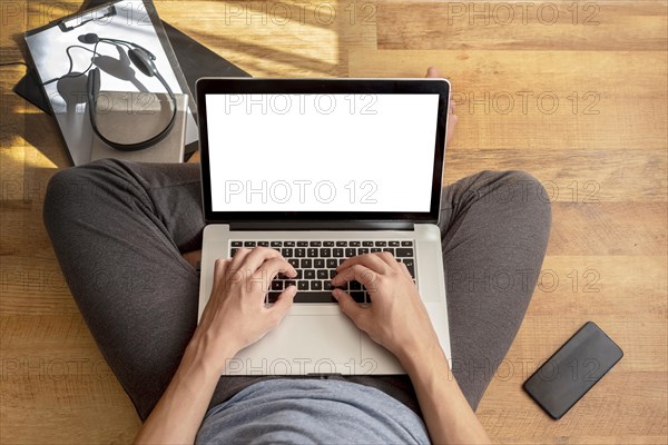 Top view man using laptop home quarantine work