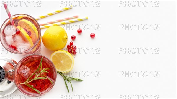 Top view glasses cranberry vodka with lemon ice with copy space