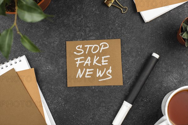 Top view stop fake news concept