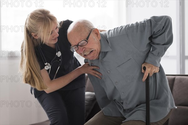 Old man pain helped by nurse