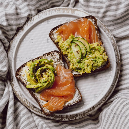 Top view breakfast sandwiches bed with salmon avocado