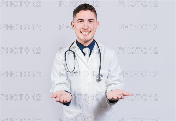 Cheerful doctor extending hands welcome. Friendly doctor extending hand in welcome isolated. Happy doctor extending hand to camera